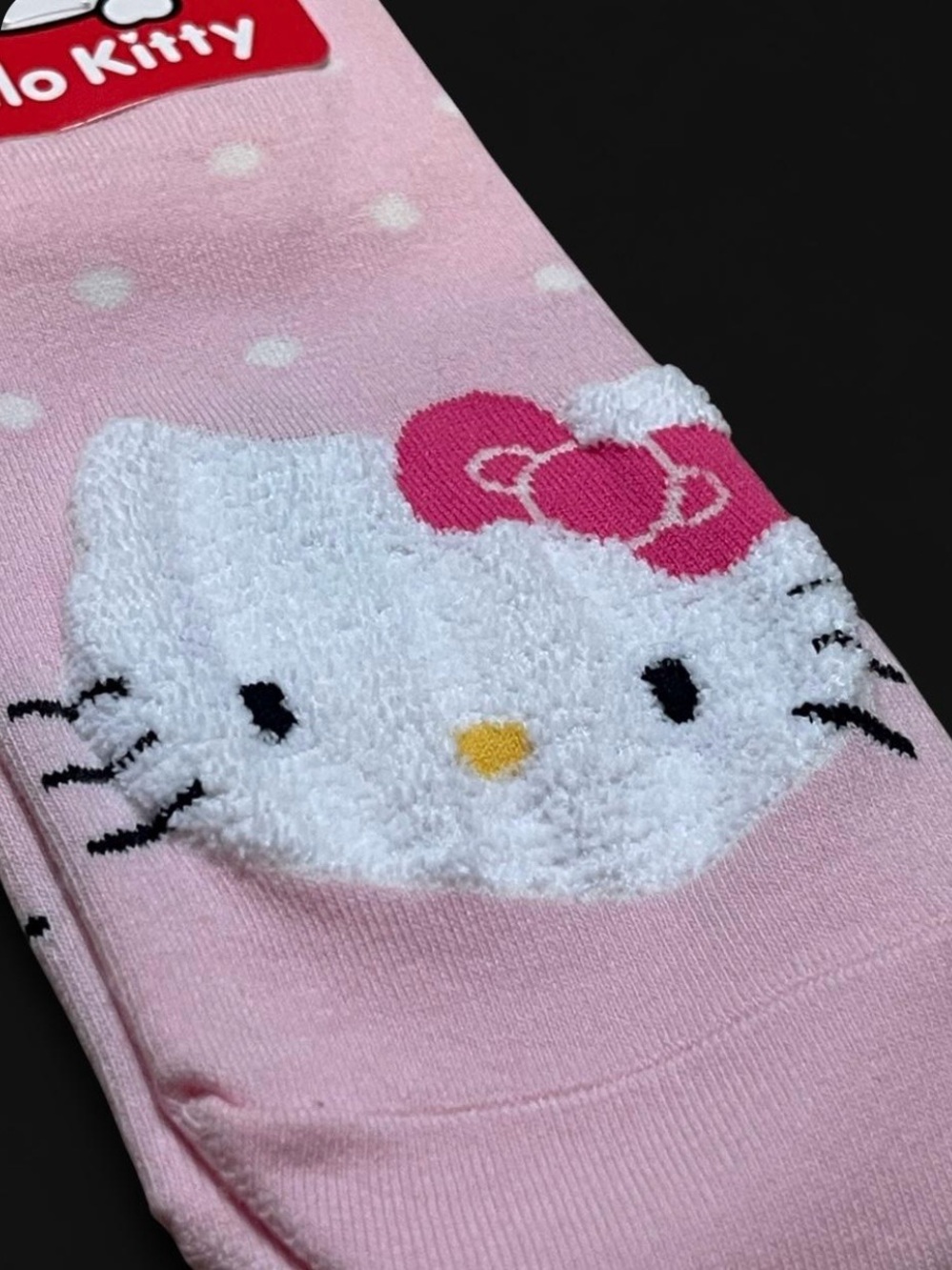 Sanrio Hello Kitty textured pink socks with white polka dots and graphs